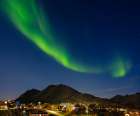 Aurora over the town. Town Tasiilaq (former Ammassalik), the biggest town in Greenland., autumn Art Print